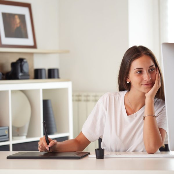 portrait of beautiful caucasian graphic designer woman working home office with graphic board on desktop. business people employee freelance online marketing.